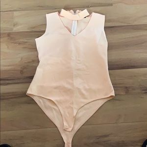 Women’s body suit with neck collar size M peach